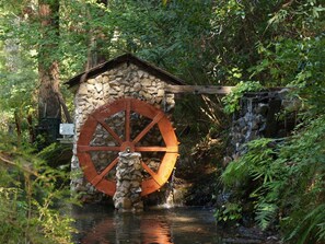 Trout pond, stone mill house, and white ribbon falls.