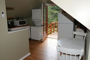 Dining area and view out exit door.  Woods surround the area.