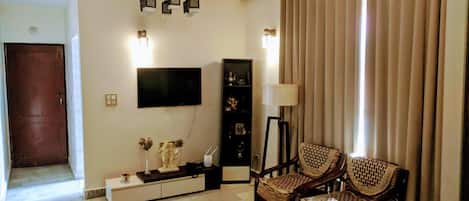 Drawing room is equipped with all amenities, 49 in digital TV, WIFI 6 seater sof