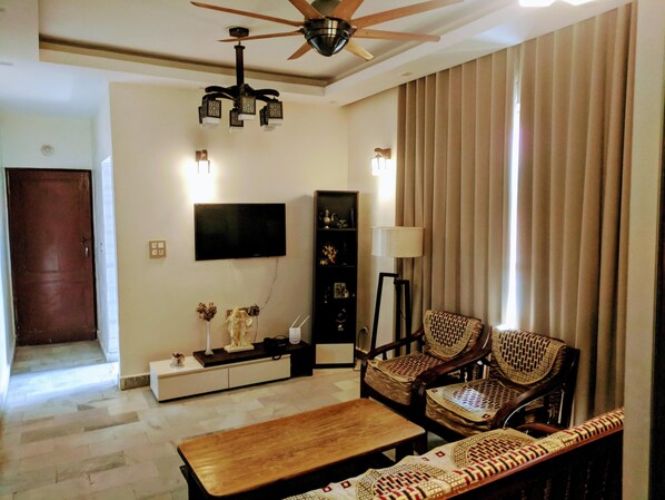 Drawing room is equipped with all amenities, 49 in digital TV, WIFI 6 seater sof