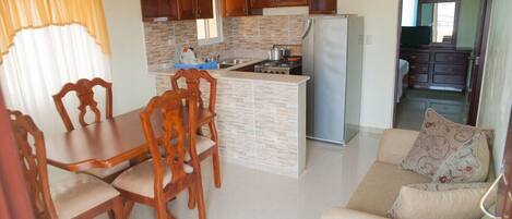 Fully furnished one bedroom apartment with full kitchen and dining room