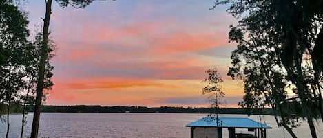 Enjoy stunning lakefront sunsets from the dock, the porch or inside the house.  