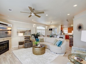 Architectural details in this living & dining room with crown & accent lighting.