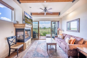 Cozy family room with fireplace, sleeper sofa and smart tv. The perfect spot to unwind after a long day of exploring #Parkcity