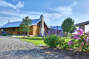 Side view of cabin and stone chimey