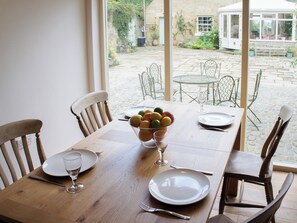 Dining area with view out over the courtyard | Swansfield Stables, Alnwick