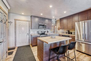 Stainless steel appliances and center island. 