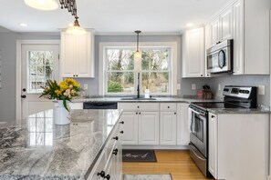 Beautifully renovated kitchen, fully stocked with everything you need.