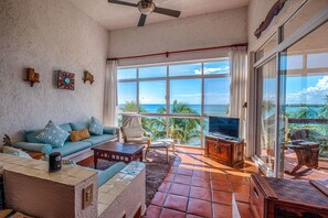 Living area with view of Half Moon Bay - La Sirena condo 13 Akumal Mexico vacation rental