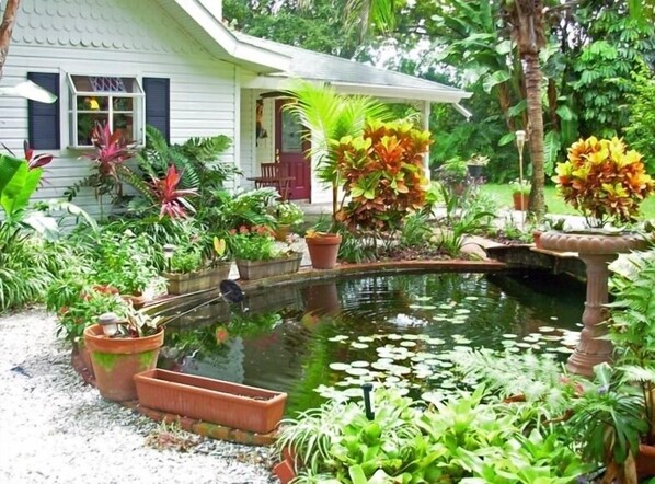 Front of cottage with Koi pond and walking bridge