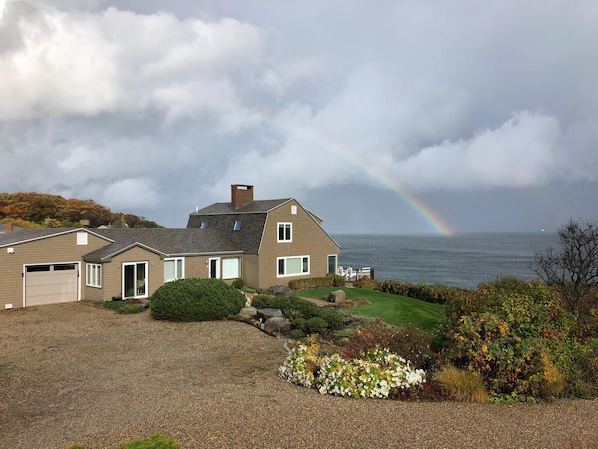 Rainbow over Breakwater House and ocean