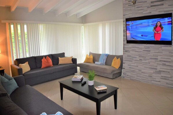 Villa has huge open great room with HDTV.