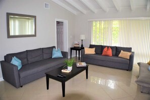 Living area has two queen convertible sofas.