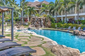 A waterfall at the pool awaits you