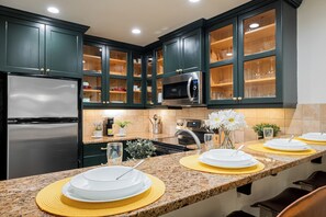 Fully Equipped Kitchen with Stainless Steel Appliances and Granite Countertops