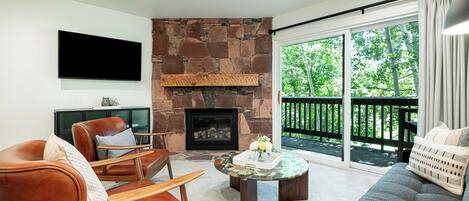 Cozy Stone Fireplace  and a Smart TV