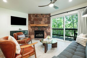 Cozy Stone Fireplace  and a Smart TV