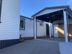 Carport for one car + off-street parking for 2 more