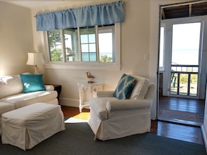 Small comfortable cottage with great views. Steps to the beach outside your door