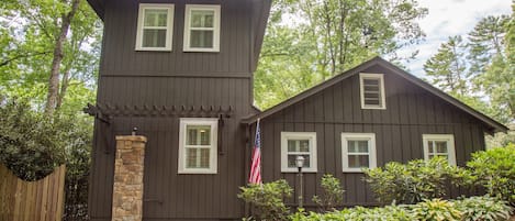 Front exterior with courtyard entry on the left.