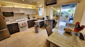 Kitchen with view of rear patio
