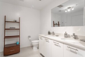 Master bathroom with double sink and large shower.