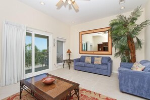 Our South Padre Island condo rental has a living room with a private balcony overlooking the bay.