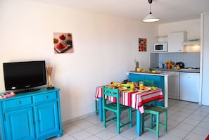 Prepare meals in the kitchenette and enjoy them at the dining table.