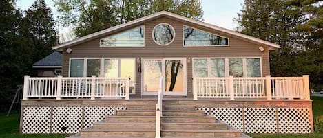 Front of the home. Deck accessible from door, stairs, and ramp. 