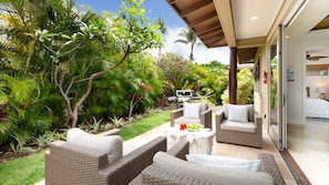 Privacy in your backyard surrounded by a tropical garden. Enjoy coffee or afternoon spirits on the lanai.
