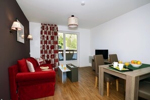 The lovely open-concept living area provides a relaxing atmosphere for your stay.