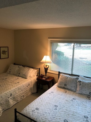 Two queen size beds in third bedroom