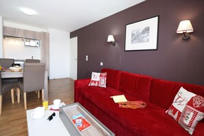 Sink into the plush sofas and watch the TV with your group at the end of a long day outside.
