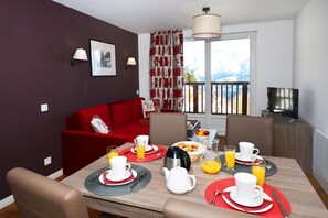 The lovely open-concept living area provides a relaxing atmosphere for your stay.