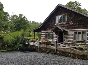 Side view of house with plenty of parking and only one step up onto the porch.
