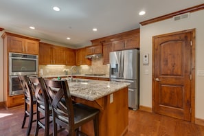 Kitchen with stainless-steel appliances, and spacious island