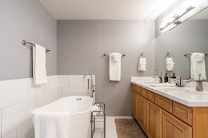 Soak up in this incredible tub after a long day, in this fully stocked bathroom with plenty of 5-star bath linens!