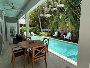 Covered Lanai, turf and lush landscaping makes for a perfect backyard retreat.