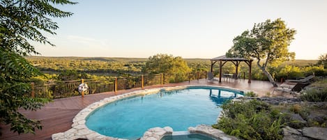 Backyard swimming pool with beautiful hillside view