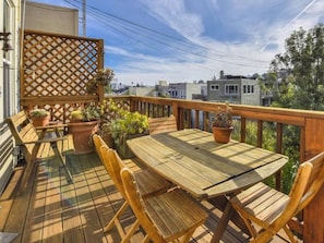 Warm and sunny back deck with amazing views and seating for four. 