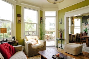 Sun-filled den walks out onto a south-facing back deck. 