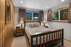 In the entry hall to the right is our first Queen bedroom, windows facing the front and east side of the home