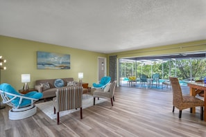 A formal living room with an incredible view!  Nearly the entire wall with sliding doors opens wide.  (turn A/C Off)