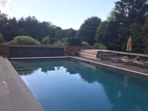 Dusk is always a great time to sit by the pool and take a hot outdoor shower. 