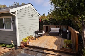 deck attached to the cottage (occasionally shared with main house)