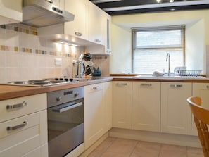 Well appointed kitchen with modest dining area | Annie’s Cottage, Millom