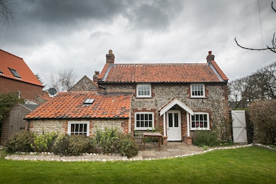 Charming detached flint cottage on village green, 5 minute stroll to beach