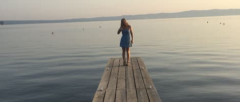 My Daughter on the little jetty from the beach ,water is shallow .