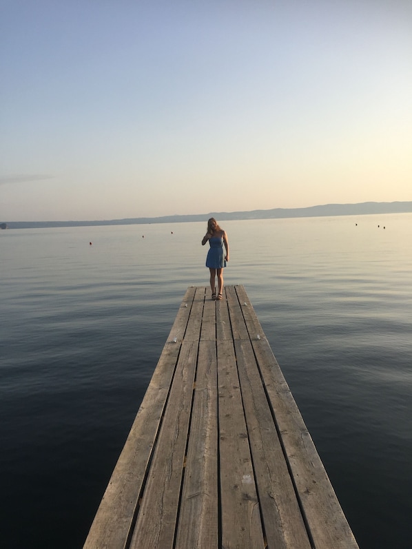 My Daughter on the little jetty from the beach ,water is shallow .