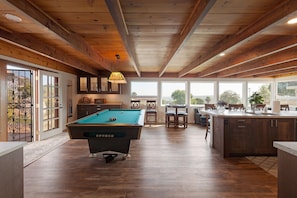 Downstairs game room and kitchen with panoramic views.